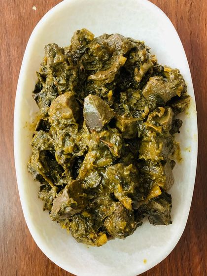 A full plate of the beef liver and gallbladder pickle. The dark, rich colour comes from the spices and the slow cooking process.