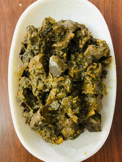 A full plate of the beef liver and gallbladder pickle. The dark, rich colour comes from the spices and the slow cooking process.