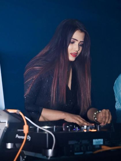 Deep in concentration, selecting the next track to keep the party going. Every spin is intentional, aimed at creating a memorable night.