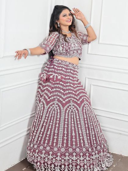 This angle showcases the beautiful fall of the lehenga skirt. The chevron pattern created with sequins and embroidery is a modern take on classic bridal wear.
