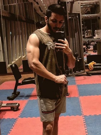 Chasing the pump. This is a post-workout shot where the muscles are full of blood, a great sign of an effective training session.