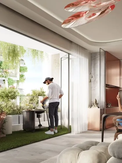 An apartment interior at Sky Gardens, where the living space opens completely to a green terrace, embodying the concept of indoor-outdoor living.