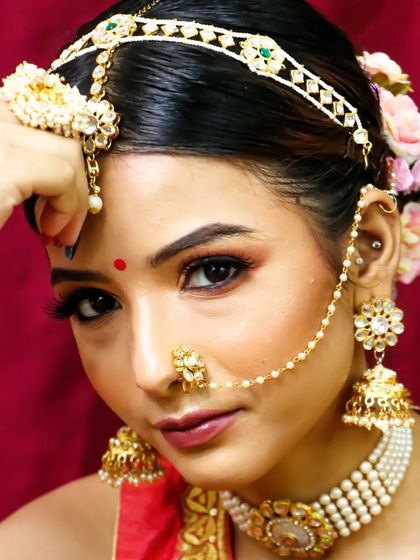 Her simplicity speaks a thousand words. This close-up showcases a beautiful, soft bridal look with a focus on clean skin and defined eyes.