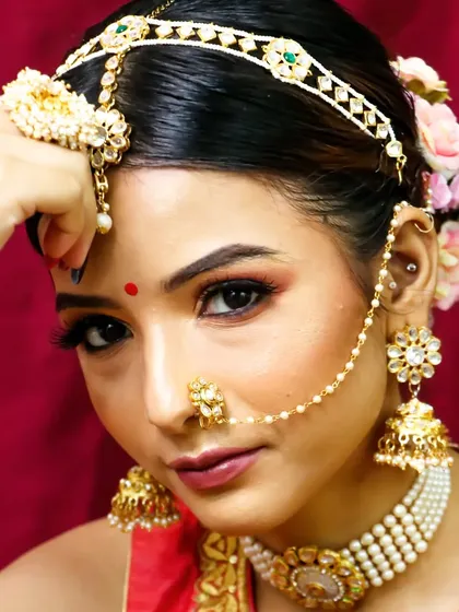 Her simplicity speaks a thousand words. This close-up showcases a beautiful, soft bridal look with a focus on clean skin and defined eyes.