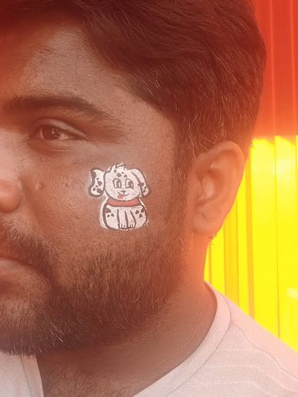 Even I get in on the fun sometimes. Here I am with a cute puppy design on my cheek.