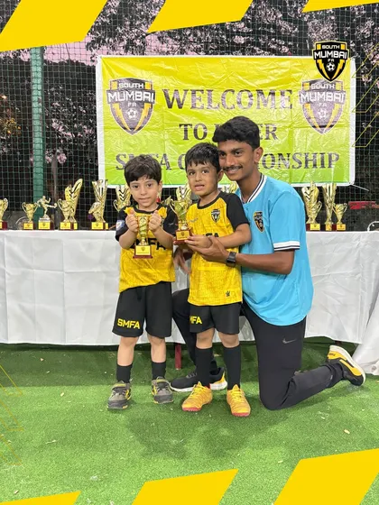 Two of our toddler champions with their coach. We provide personalized attention to ensure every child develops at their own pace.