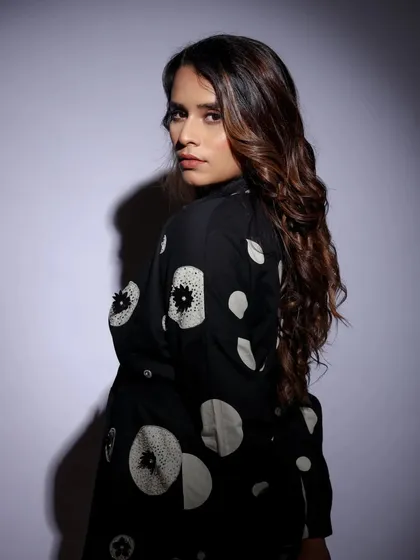 A classic over-the-shoulder look. This pose is both alluring and confident, a must-have for any model's portfolio.