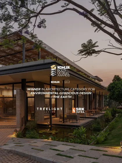 We were thrilled to win in the 'Environmental Conscious Design' category at the Kohler Bold Design Awards for 'The Earth'. The award graphic is shown against the building's exterior, which blends seamlessly with its natural setting at dusk.