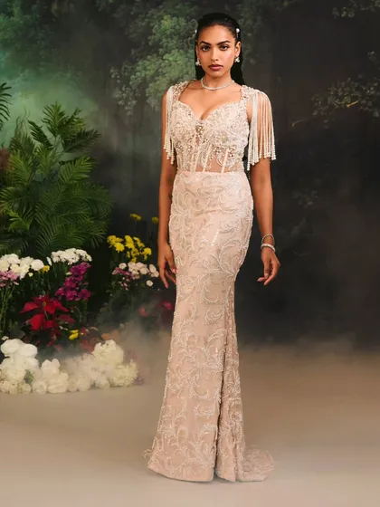 The full silhouette of the Nuray Gown, where the embellished, sheer corset top meets a gracefully embroidered skirt for a look of sophisticated glamour.