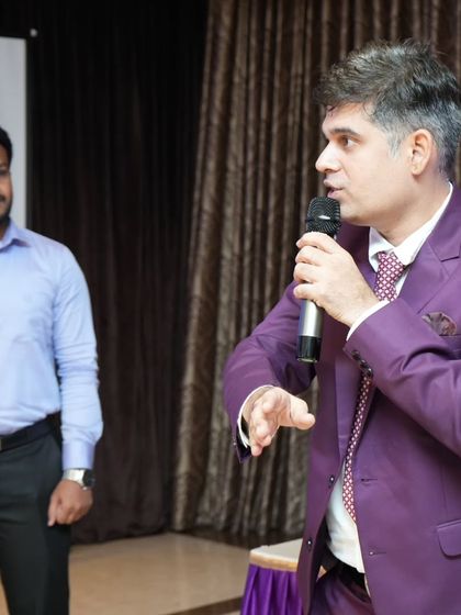 Giving instructions for an on-stage activity. My direct and clear communication style ensures everyone understands the game and can participate fully.