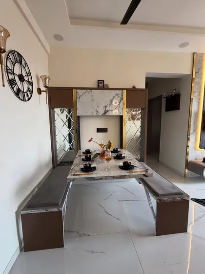 A full view of the convertible dining area, showing the bench seating and how the entire setup can be folded away to create more living space. This is smart design for modern apartments.