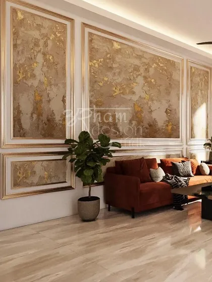 On the opposite wall, I designed these large, textured art panels with gold leaf accents to add a layer of luxury and artistry. This feature wall becomes a sophisticated backdrop for the entire living space.