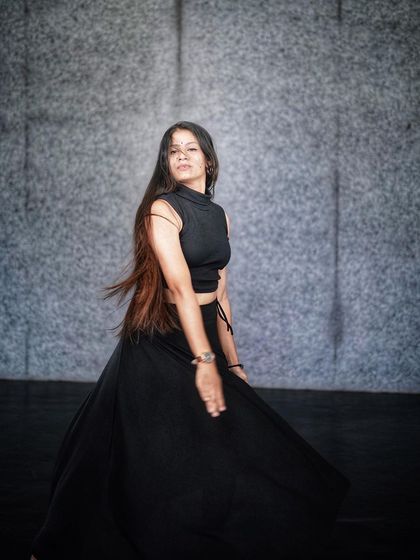 A fluid turn during a dance practice. These foundational movements are part of what we teach in our classes at R1 Dance and Yoga Studio.