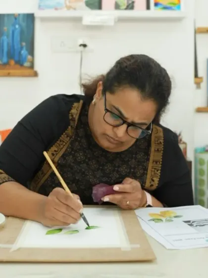 This student is deeply focused on her watercolor painting, a key medium covered in our comprehensive 3-month certificate program.