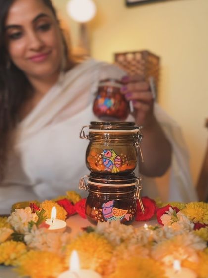 Our hand-painted airtight jars are perfect for festive gifting. Here they are stacked and filled with treats, ready for Diwali celebrations.
