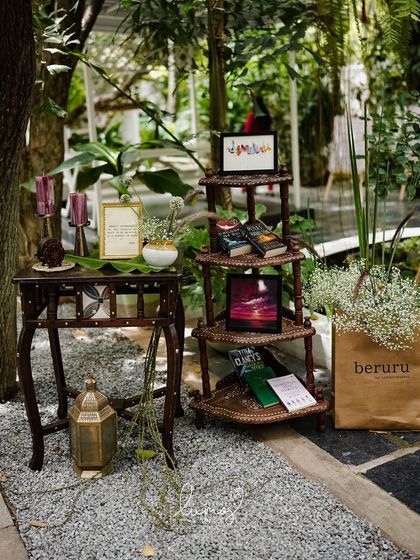Another view of the personalized corner, with books, art, and a sign referencing the couple's favorite cafe, Beruru.