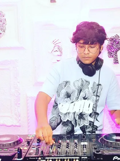 In the zone, mixing tracks at a party. This is where I feel most at home, crafting the perfect set to keep the disco going all night.