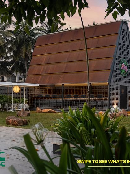 A view of our unique A-frame building from the lawn. It's a great spot for events, gatherings, or just finding a quiet corner to yourself.