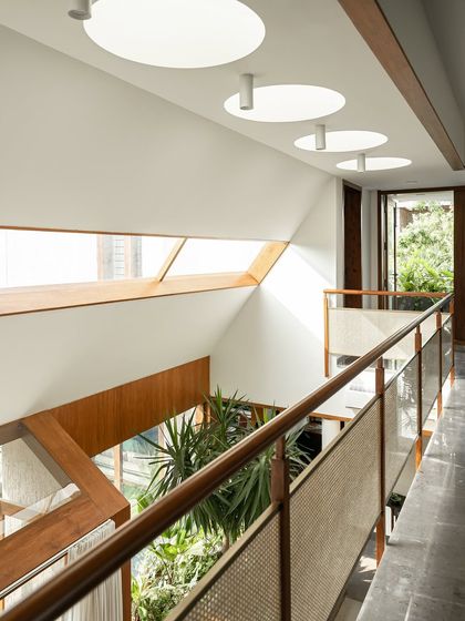 This view from the upper bridge shows the connection between different levels. The open design allows light and views to be shared across the home, enhancing the sense of space and community.