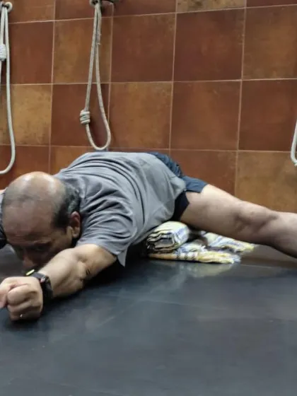 A forward bend in Upavistha Konasana.