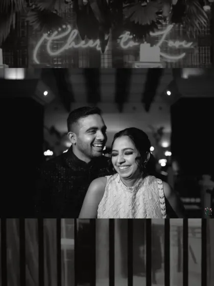 Laughter under a 'Cheers to Love' sign at a Sangeet night in Goa. This black and white shot freezes a genuine, candid moment, showing the fun and energy of wedding celebrations.