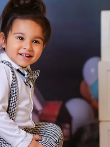 Celebrating turning two with a big smile. Our studio is equipped with props like these large number blocks to mark every important milestone.