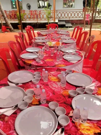 A simple and neat round table seating arrangement for a wedding event in Pen. I can provide basic table setups as part of my catering service.