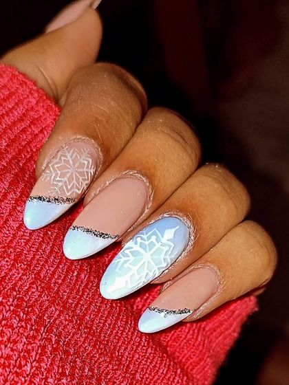 Who says you can't have snowflakes in the summer? This winter-themed design features delicate hand-painted snowflakes on a baby blue base with a touch of silver glitter for a cool and magical vibe.