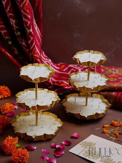 A closer look at our tiered Stand Urli Candles. These pieces are perfect for adorning the mandir, welcoming guests, or adding a magical touch to your celebration decor.