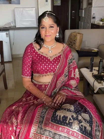 A beautiful, soft makeup look for the bride's sister. The focus is on enhancing her natural beauty with a touch of pink on the eyes and a glowing complexion.