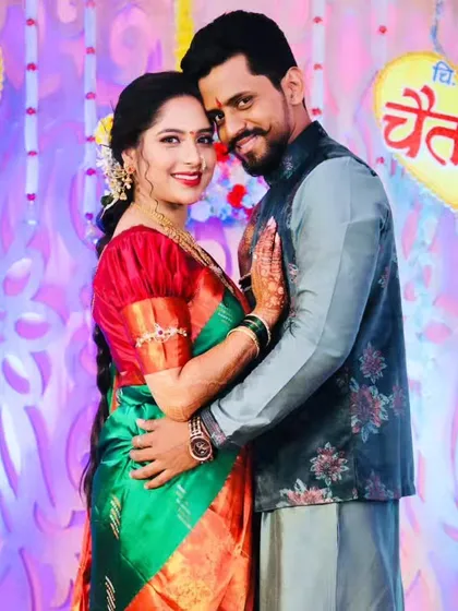 A warm embrace between the couple, capturing the joy of their engagement.