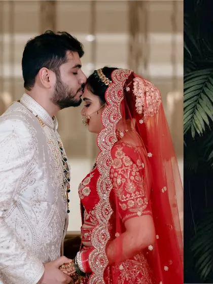 A groom's gentle kiss on his bride's forehead, a timeless expression of love and care captured on their wedding day.
