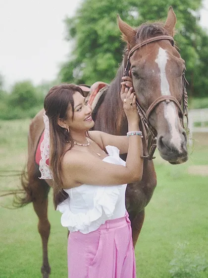 A close-up shot of a rider and horse, highlighting the gentle interaction and mutual comfort between them.