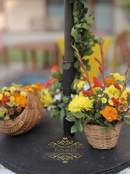 A centerpiece detail, with a small cane basket of flowers placed on the table.