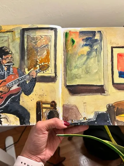 I was so inspired watching this musician at an artists' community event. This watercolor sketch captures him lost in his music, surrounded by art. It’s a great example of how I document live performances and the special moments that make an event memorable.