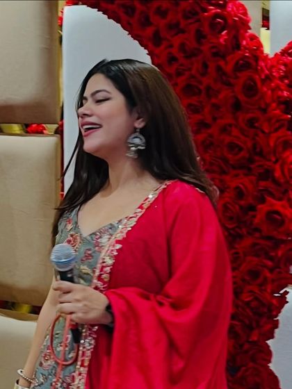 Singing along with the music during a Sangeet. I'm not just a host, I'm a participant in the celebration.