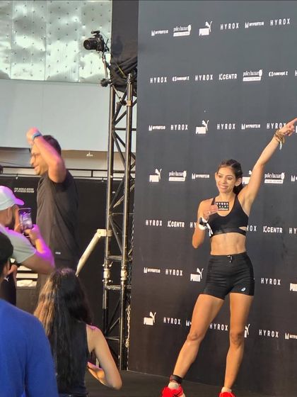 Celebrating at the finish line. This is the feeling of accomplishment after pushing your body to its limits. It's a testament to the hard work and a moment of pure joy.