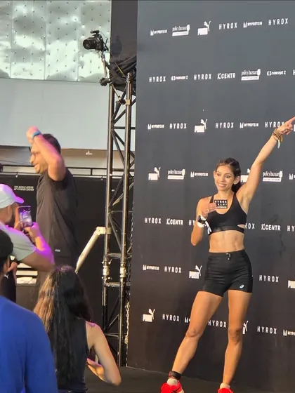 Celebrating at the finish line. This is the feeling of accomplishment after pushing your body to its limits. It's a testament to the hard work and a moment of pure joy.