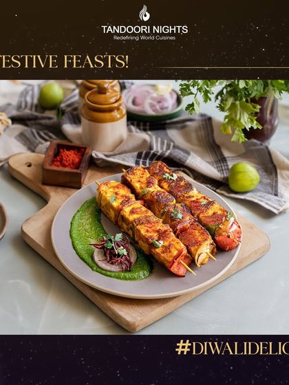 Our festive feasts for Diwali include classic favorites like this Paneer Tikka, grilled to perfection and served with a vibrant green chutney, making your celebration unforgettable.