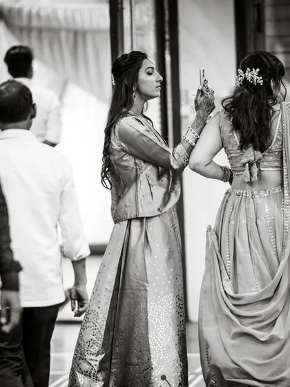 A candid moment from a Gujarati wedding, capturing guests in between events.