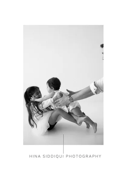 A close-up of a sweet sibling embrace. My documentary style focuses on these real, unscripted moments that reveal the deep connection within a family.