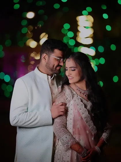 A sweet moment between this lovely couple at their engagement. Her soft pink lehenga is complemented by a romantic makeup look with a focus on radiant skin.