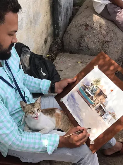 During the demonstration in Porbandar, a friendly cat decided to join me and sat on my lap the entire time.