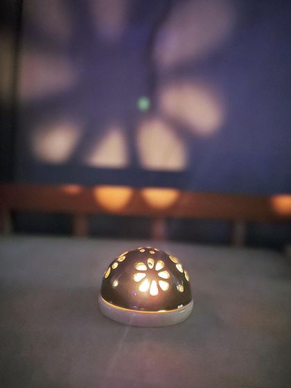 The beautiful shadow play from one of our carved tea light holders. It's like a piece of art that comes alive with light.