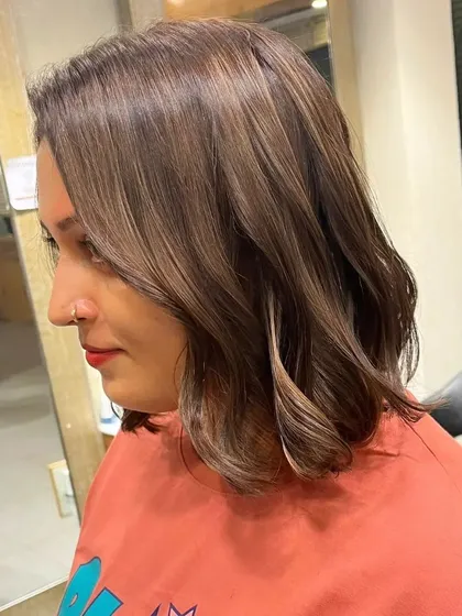 The final result of the babylights on a bob haircut. The color is soft, blended, and gives the hair a beautiful, healthy glow.