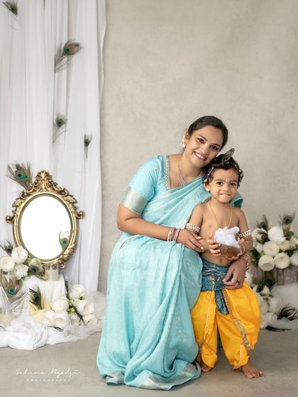 A mother's love for her little Krishna. The joy and pride in her expression are just beautiful.