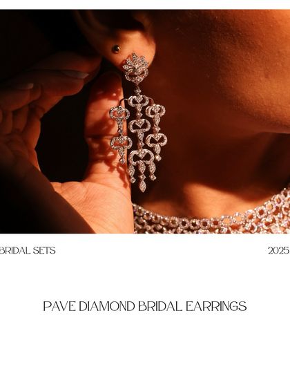 A model wearing the Pave Diamond Bridal Earrings, demonstrating how they frame the face and complement a bridal look with their intricate sparkle.