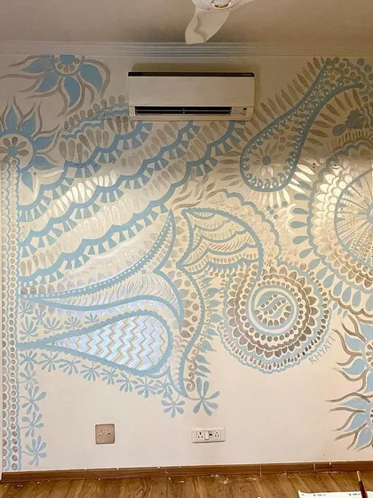The full view of the Delhi mural, designed to flow around the air conditioner and doorways. I always work with the existing features of a room to ensure the art feels integrated and natural.