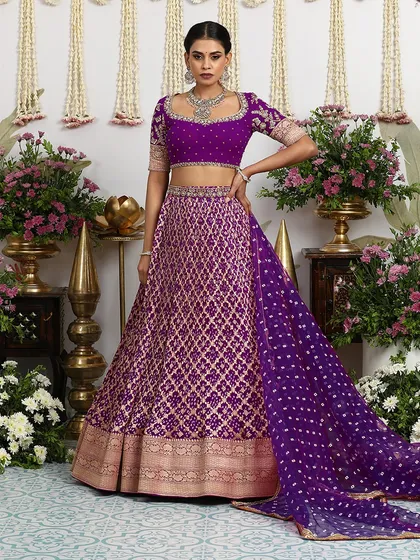 The full, standing view of the purple Banarasi lehenga, a true masterpiece from our "Kesariya" collection.