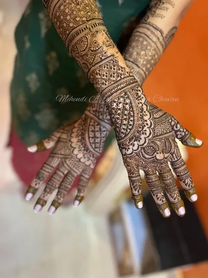A beautiful and intricate mehendi design. The patterns are a mix of traditional motifs, creating a timeless and elegant look.